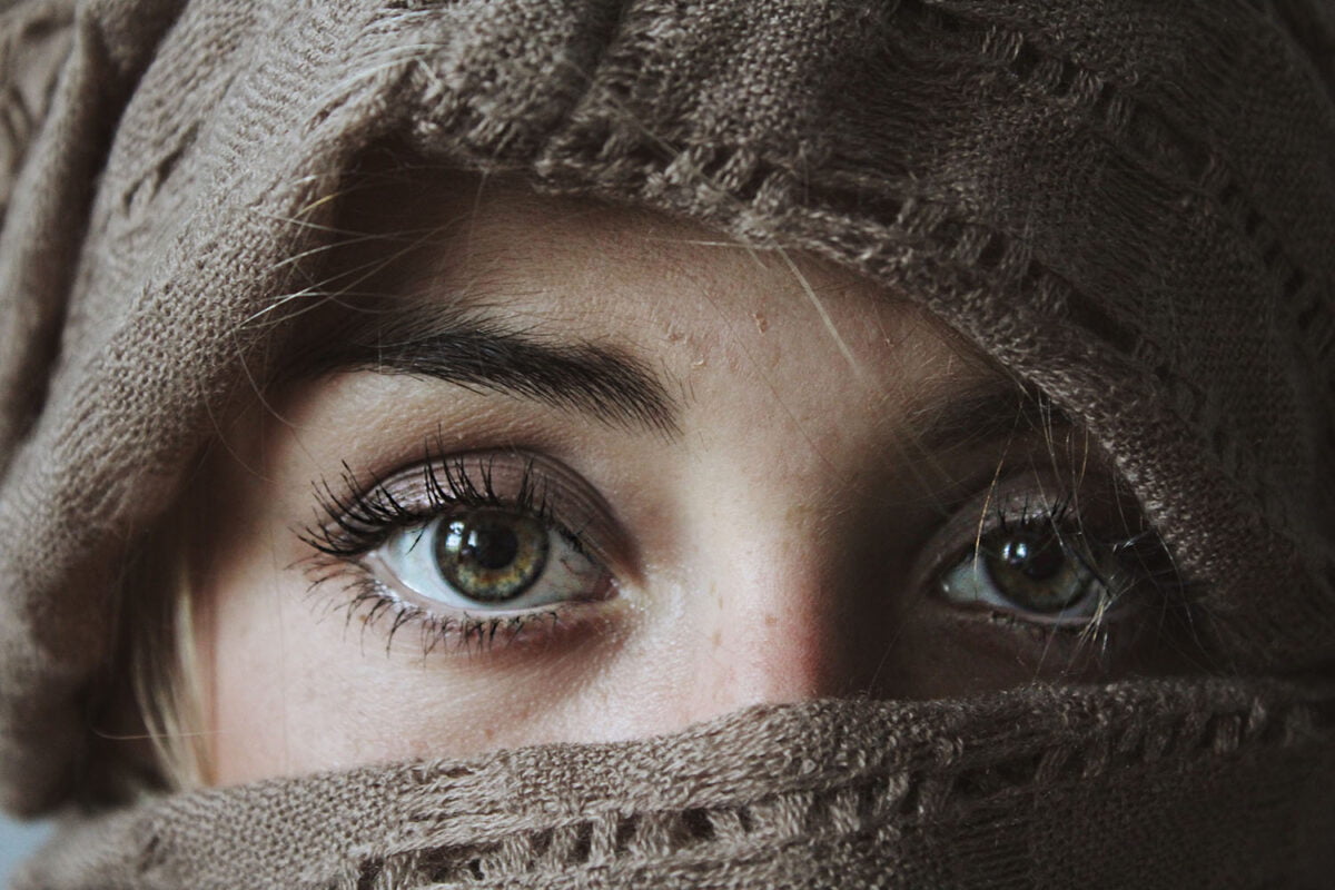 Woman with face covered, and eyes showing
