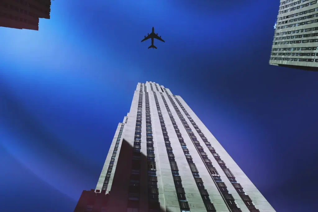 airplane flying over the Empire State Building in New York City
