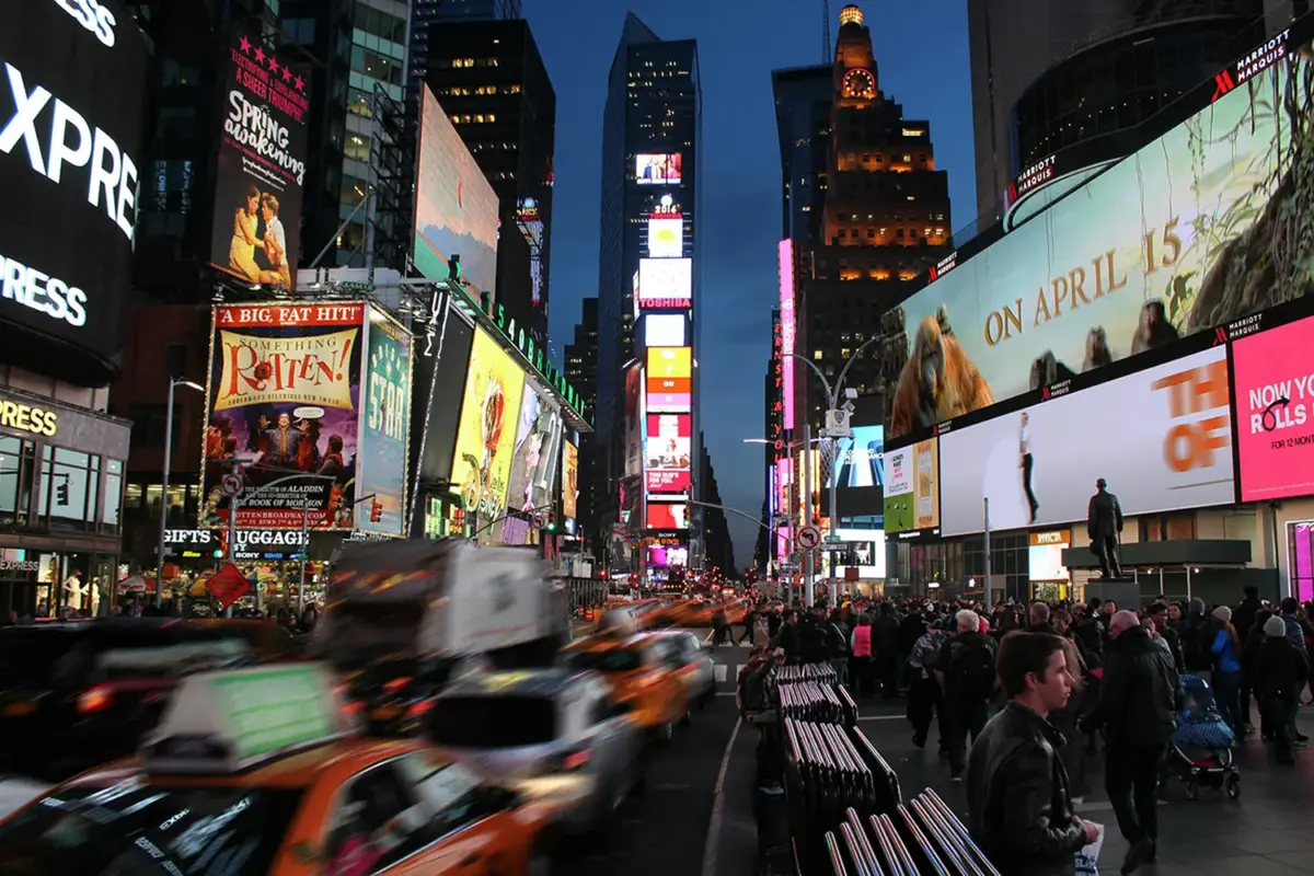 A busy Times Square, NYC, at night.